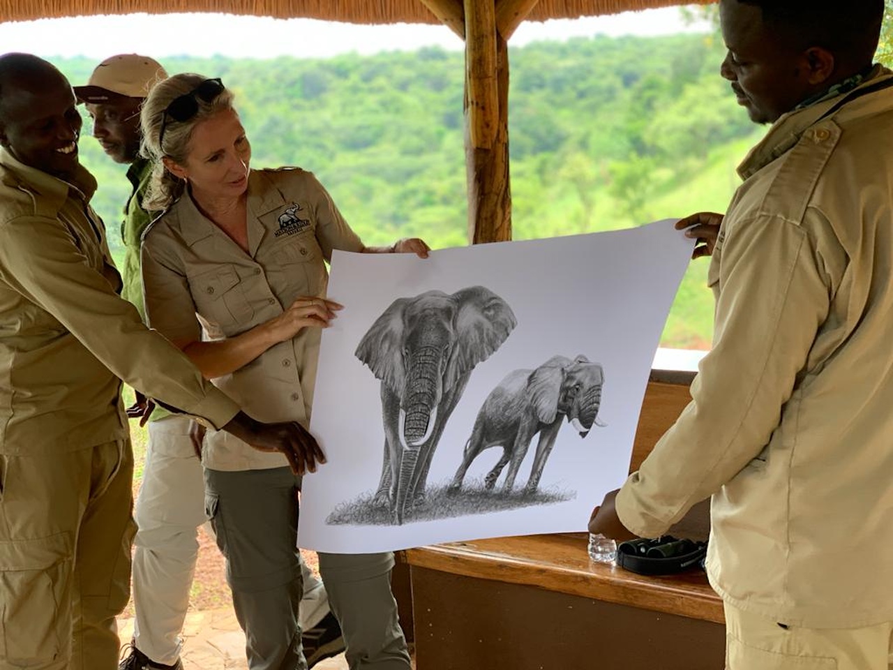 Tammie with ele drawing Akagera guides